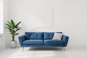 In a simple white living space featuring a poster, a plant sits beside a blue couch with a pillow. authentic photo