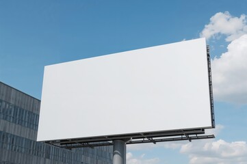 Obraz premium Large white billboard outside a structure, featuring only a text mockup