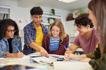 Multiethnic students studying together at secondary school