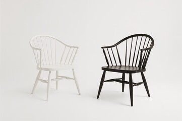 Vintage white and black chairs isolated on a plain white backdrop