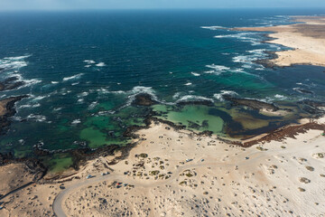 Aerial View of Los Charcos Beach with Stone Wind Shelters