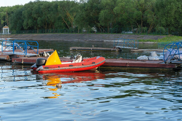 Inflatable rescue boat equipped with steering console. Safe haven for exploration a red inflatable...