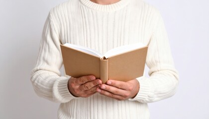 Person Reading Open Book In Light Sweater