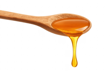 Honey dripping from wooden spoon on transparent background