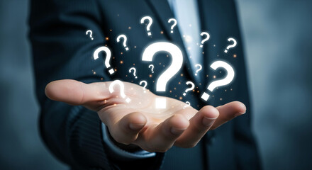 Hand holding glowing question marks, symbolizing inquiry, problem-solving, and seeking answers, ideal for business or FAQ concepts