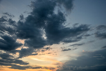 Tranquil beauty of a sunset sky, with a stunning array of vibrant colors and dramatic cloud...