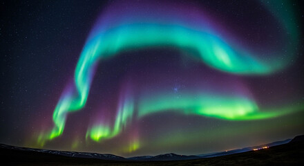 Witness the mesmerizing dance of vibrant green and purple aurora borealis illuminating a starry night sky over distant mountains