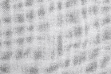 Bleached white and grey textured background of woven sackcloth fabric