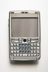 Vintage Mobile Phone Lying on White Background