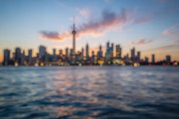 Fototapeta premium Blurred urban lights with water and sky, abstract bokeh background, colorful travel scenery wallpaper
