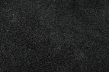 Obraz premium Monochrome rugged stone pattern. Coarse rock face up-close. Similar to weathered concrete wall. Dim gray distressed backdrop with room for graphics. Layout template. Background image. Extended