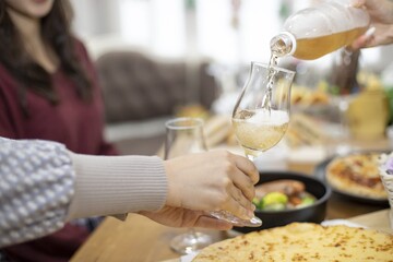 waiter serving champagne at restaurant