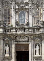 Igreja do Carmo church entrance in Porto Portugal with ornate statues and baroque details. Religious