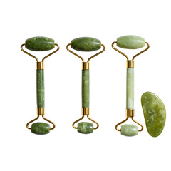 Green jade rollers and gua sha tools for skincare on transparent background