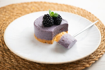 Blackberry mousse tart with a biscuit base. Traditional French recipe.