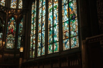 A vibrant stained glass panel inside a chapel
