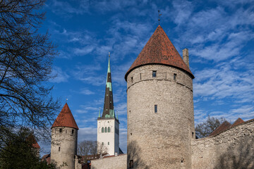 Obraz premium Towers of City Wall And St Olaf Church in Tallinn, Estonia