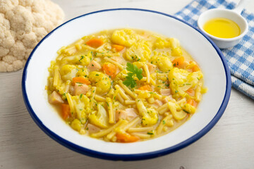 Cauliflower and vegetable soup with short noodles. A special winter recipe.