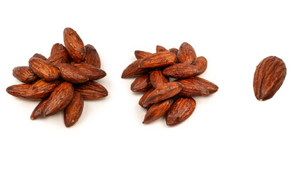 A group of caramelized almonds isolated on a white background.