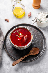 Traditional Ukrainian beet soup - borscht on the light background vertical photo