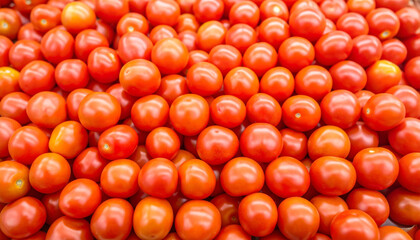 Fresh firefly tomatoes piled in abundance with bright red and orange colors, natural shine, and fresh harvest theme creating vibrant and appetizing display