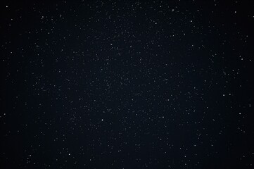 Fototapeta premium A cosmic display of numerous stars scattered like sand along a shore under a dark night, featuring zodiac constellations.