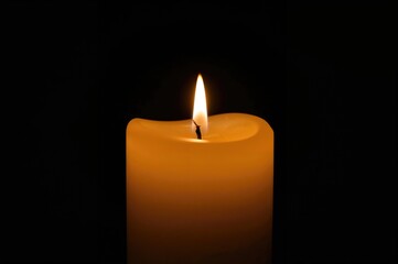A lit candle emitting a warm glow