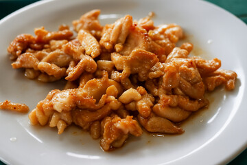 Garlic Chicken Stir Fry on White Plate, Thai Style Fried Chicken with Garlic, Homemade Asian Cuisine Food Photography
