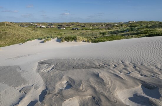 Dunes with beach grass, wave pattern in the sand, holiday settlement, blue sky, Hvide Sande, North Sea, Denmark
