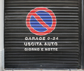 car exit day and night do not park sign