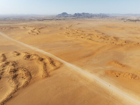 The C14 gravel road at the edge of the Namib Desert. Aerial view. Drone shot. Namibia