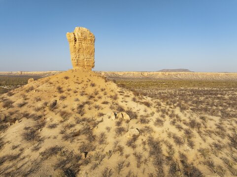The Vingerklip (rock finger) and the Ugab Valley Terraces are surrounded by thornbush and mopane (Colophospermum mopane) savanna. Aerial view. Drone shot. Damaraland, Namibia