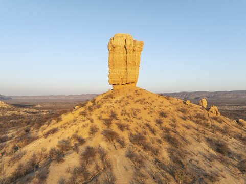 The Vingerklip (rock finger) is surrounded by thornbush and mopane (Colophospermum mopane) savanna. Aerial view. Drone shot. Damaraland, Namibia