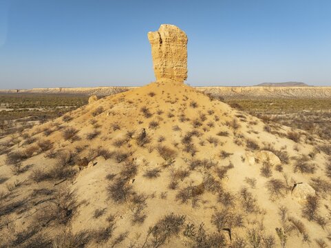 The Vingerklip (rock finger) and the Ugab Valley Terraces are surrounded by thornbush and mopane (Colophospermum mopane) savanna. Aerial view. Drone shot. Damaraland, Namibia