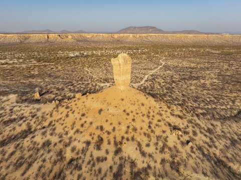 The Vingerklip (rock finger) and the Ugab Valley Terraces are surrounded by thornbush and mopane (Colophospermum mopane) savanna. Aerial view. Drone shot. Damaraland, Namibia