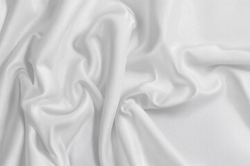 Obraz premium Folded white fabric with creases as a backdrop