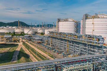 White spherical propane tanks containing fuel gas
