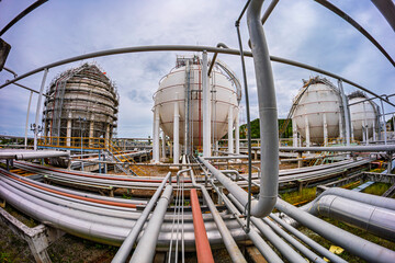 White spherical propane tanks containing fuel gas
