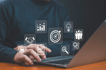 Businessman showing virtual target icon for business purpose, strategic planning for business...