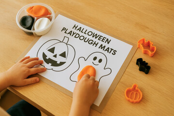 Handmade Halloween craft for kids featuring playdough mats that promote early learning and education through fun activities
