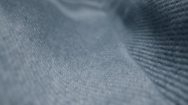 Blue textile jeans cloth texture close-up macro. Fashion fabric multicolor. Cotton casual clothes