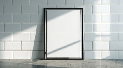 Blank framed poster on white tiled wall