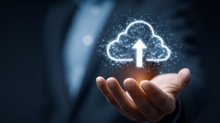 Businessman holding cloud upload icon, data transferring with blue background, for technology use