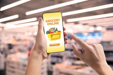 Food delivery. Man using mobile phone app to order grocery online, closeup