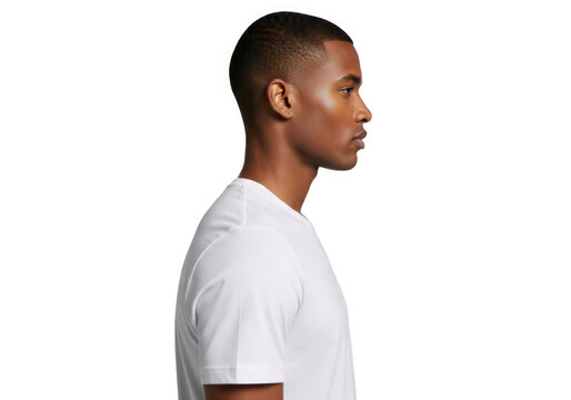 Focused Profile Portrait of a Young Black Man with a Buzz Cut Against a White Studio Background.