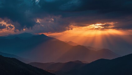 Golden sunset rays piercing through storm clouds over mountain ranges