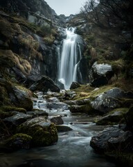 Fototapeta premium Long exposure of waterfall and moss rocks. 
