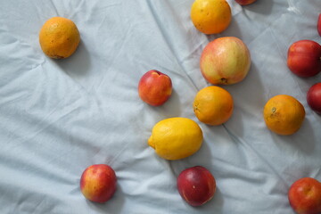 Fresh fruits on soft blue fabric background