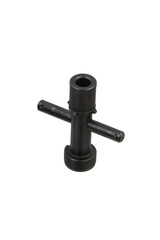 A black shotgun choke key, used for installing and removing choke tubes from a shotgun barrel, isolated on a white back