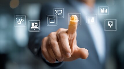 Obraz premium Businessperson's hand touching data icons to analyze information in a blurred office setting